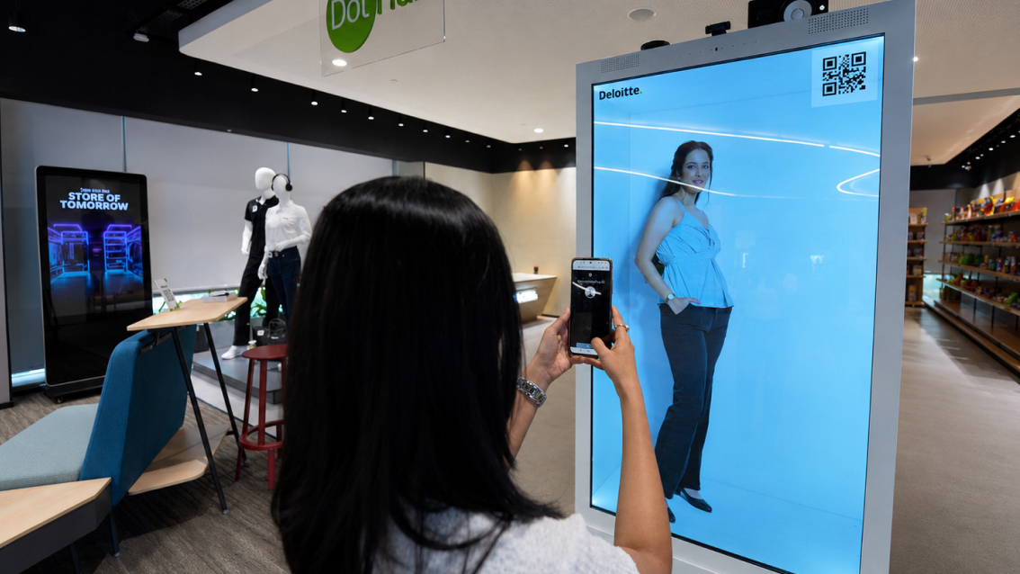 interact with virtual retail assistant display in Deloitte experience center